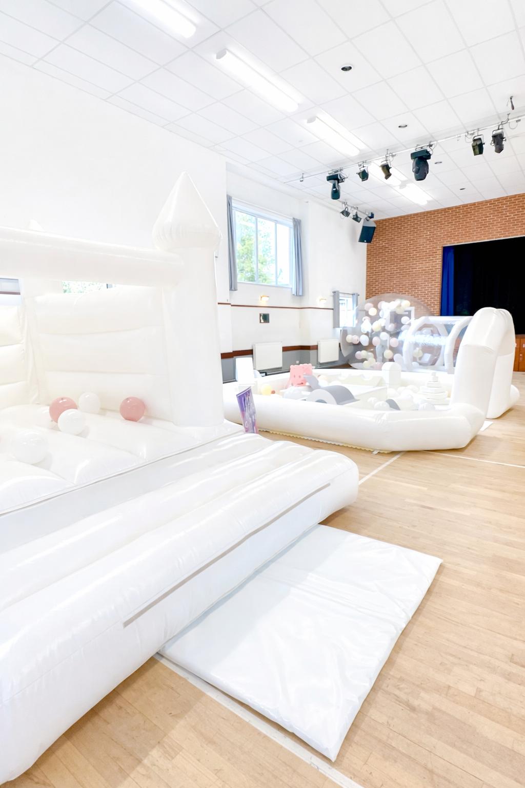 White soft play and bouncy castle full setup in event hall